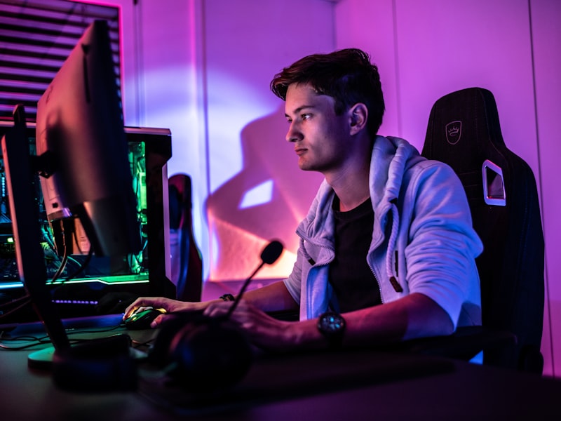 Daremiko technician cable-managing a custom gaming PC